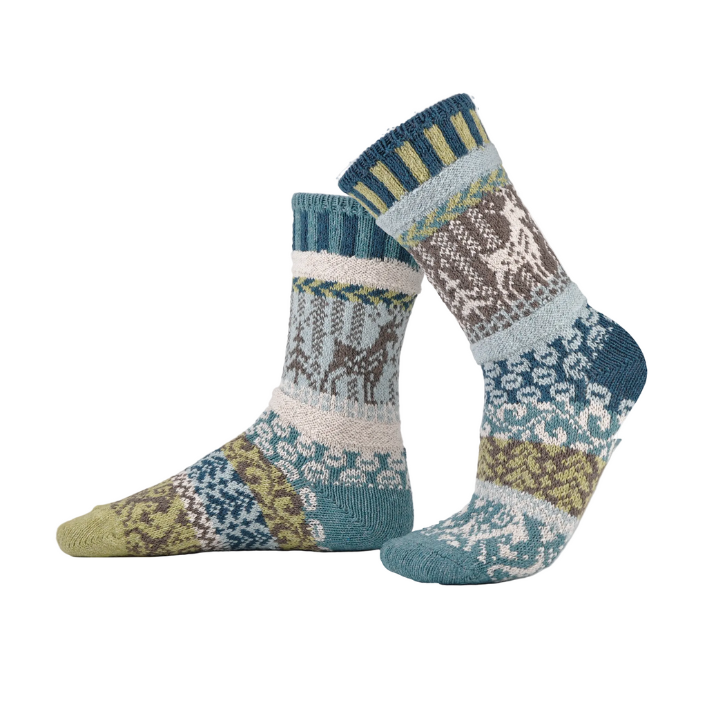 Goats on a Pair of Socks with patterns on a White background.