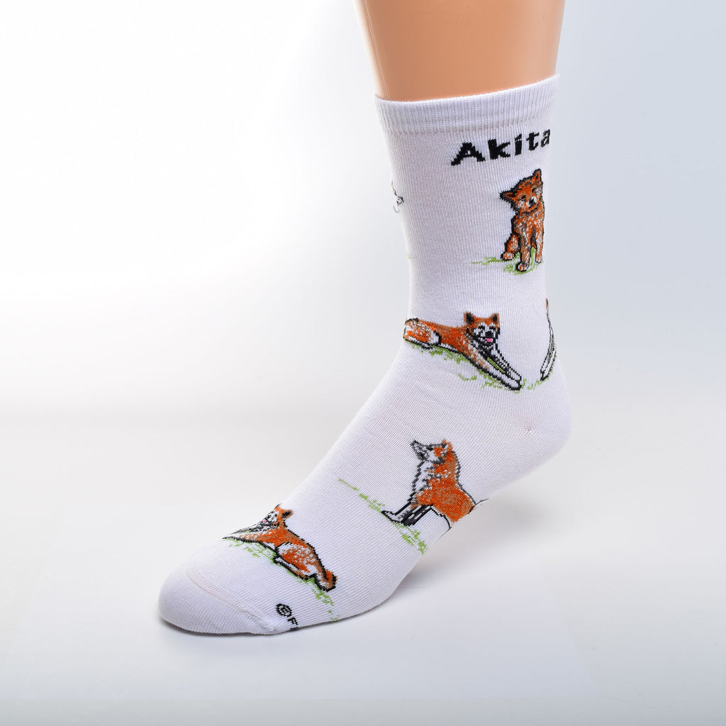 For Bare Feet Akita Poses begin on White. Akita is in bold Black under the cuff. The Akita is Mahogany, and White, and Black. The Tongue is Rose. All Poses are on a bed of Green Grass.