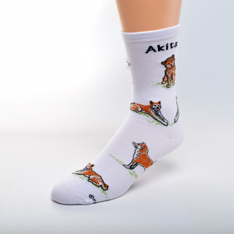For Bare Feet Akita Poses begin on White. Akita is in bold Black under the cuff. The Akita is Mahogany, and White, and Black. The Tongue is Rose. All Poses are on a bed of Green Grass.
