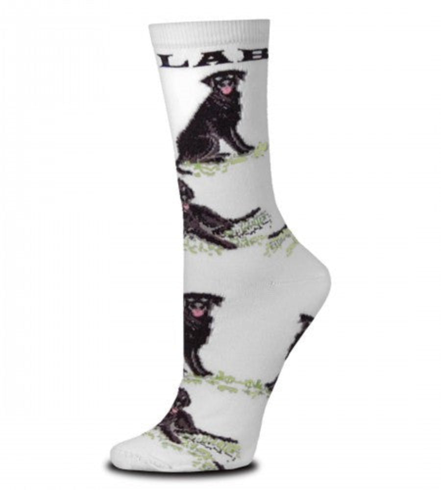 For Bare Feet Black Lab Poses Sock starts on a Bright White background. Under the Cuff reads, "LAB" in Black Bold Print. After that are Black Labs in Poses all the way down to the Toes. All the Poses are on top of Green Grass. The Labs are Black and Dark Grey and Medium Grey for Shading and Highlights. The Eyes are Grey and Black and the Mouth is Rose. The Poses are Sitting and Laying Down.