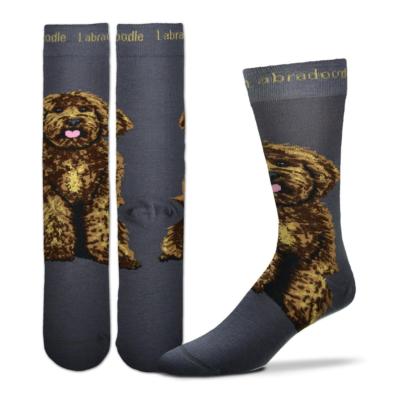 For Bare Feet Realistic Labradoodle Sock starts on a Charcoal background. Labradoodle is in Buff color in the Cuff spelled out. The Labradoodle Dog is sitting below the Heel and above the Heel going up your ankle towards your knee. He is all fluffy in fur. He is happy with a Pink Tongue and bright eyes looking out at you.