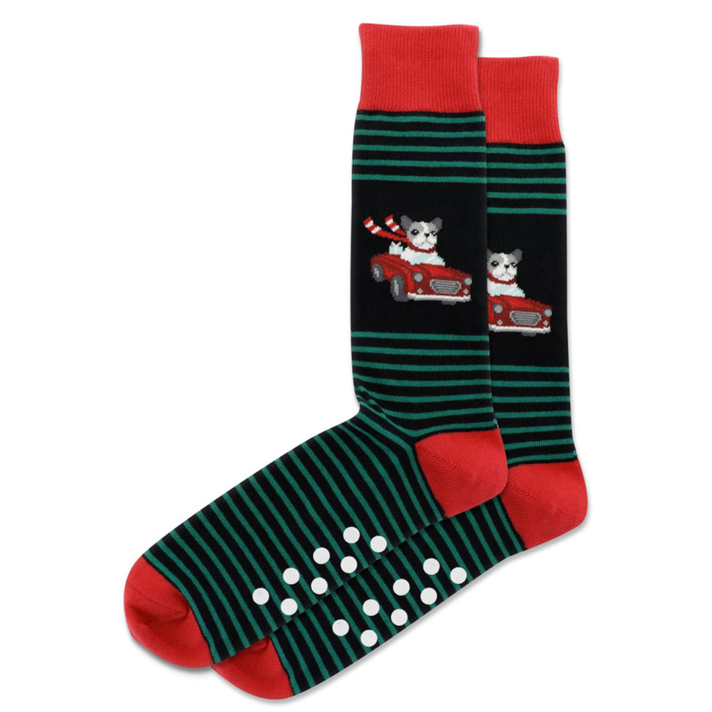 Hot Sox Mens Dog Convertible Non Skid Socks are on Black with Red Cuffs, Heels and Toes. Green Stripes frame a White, Black and Grey Dog with a Red Sash behind the Wheel of a Red Convertible.