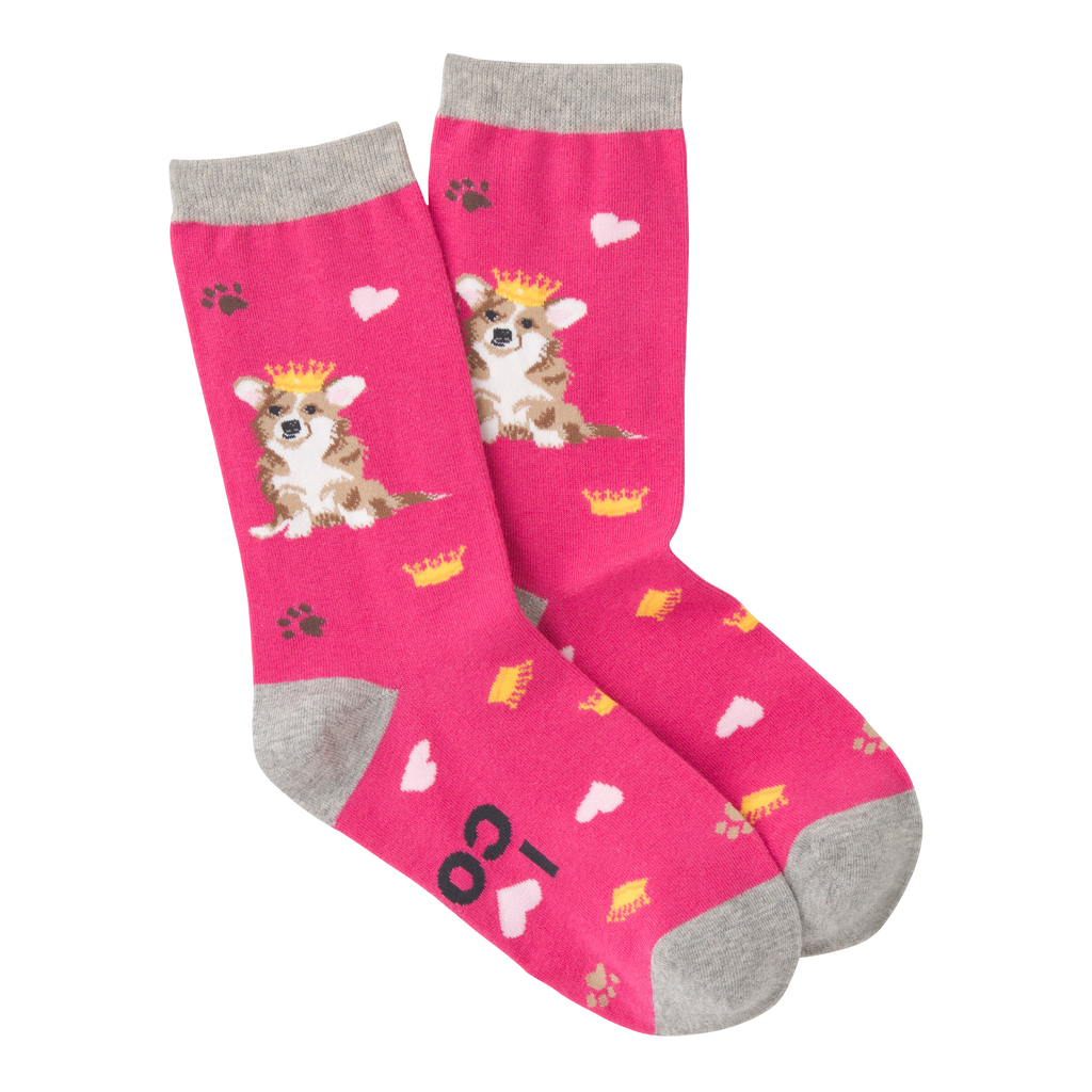 K Bell Corgi Sock starts on a Fuchsia background with Heather Grey Cuffs, Heels and Toes. The Corgi is carrying a Crown of Gold on Her Head. Their are Gold Crowns and Pink Hearts all over the Sock. Also thrown in are Paw Prints in Black and Lion. The Corgi is White, Lion, Seal Brown, Black for Nose and Eyes and Pink for Ears. On the bottom of the Sock, it reads, "I Love My Corgi".