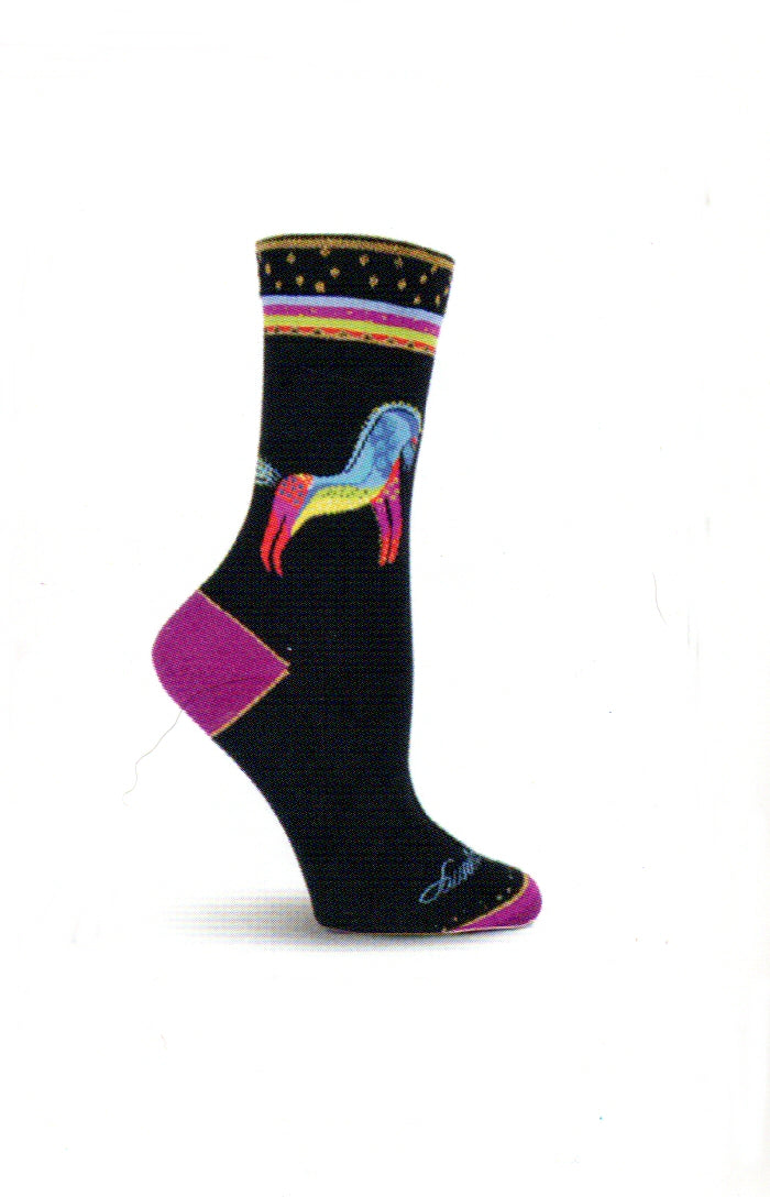Laurel Burch Rainbow Horses Sock begins on a Black background with Fuchsia Rose Heels and Toes. The Cuffs start with Gold Ribbon and Stars. Next comes thin rows of Blue Munsell, Fuchsia Rose, Pistachio, and Coquelicot with Gold Thred in Triangles with Black inside. Below the Cuff is the Rainbow Horse, the head starts with Indigo Dye and Blue Munsell down over the back. The Legs are Coquelicot Fuchsia Rose and Gold. The underside is Pistachio and Saffron.