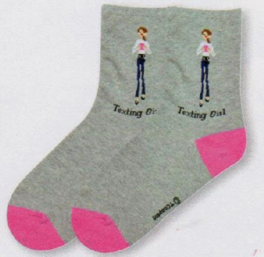 Texting Girl wearing a White Top with Blue Jeans with a Pink Phone Texting. She is on a background of Heather Grey. The Heels and Toes are Pink insoles say "The Girls".