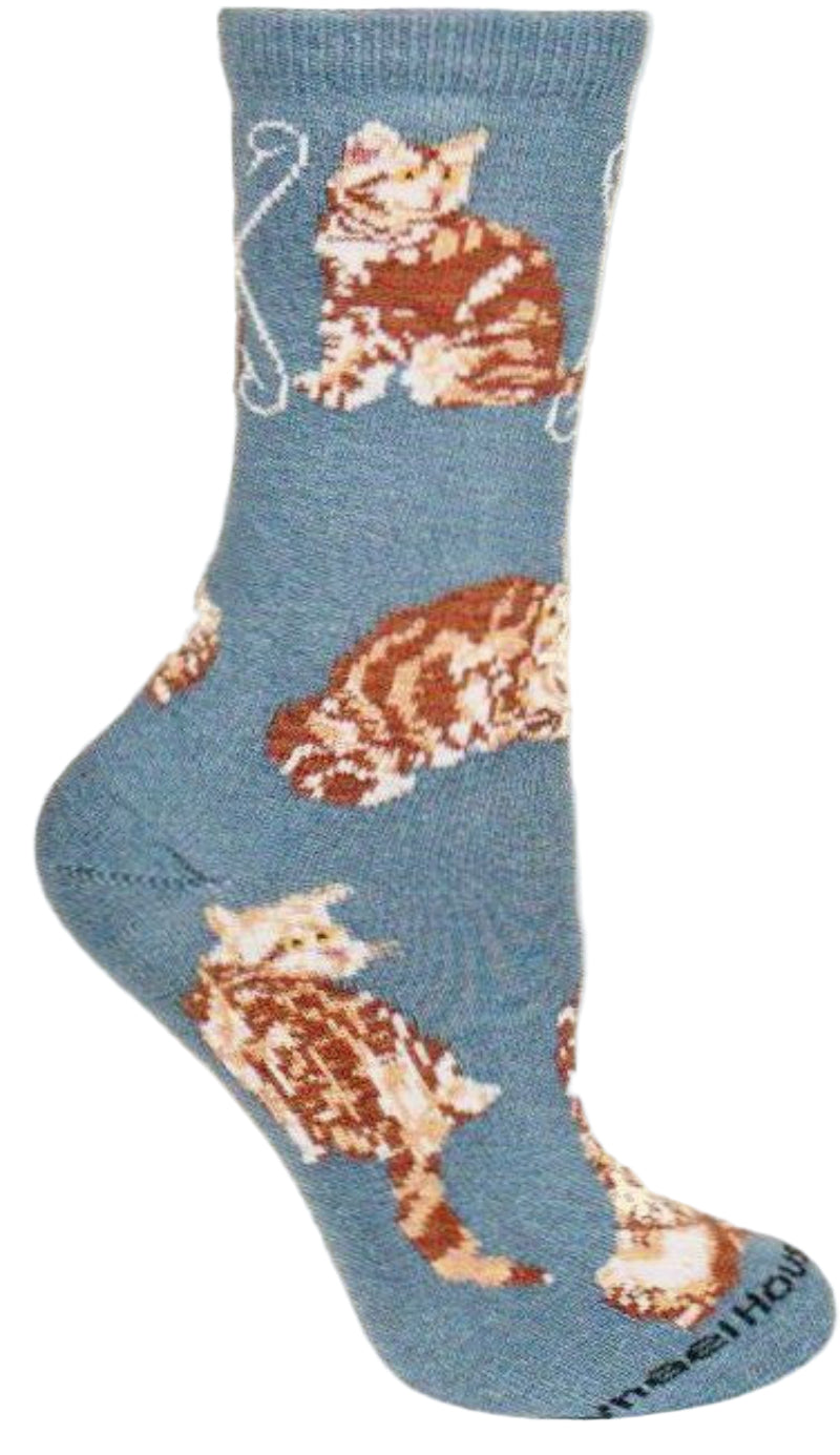 Wheel House Designs Orange Tabby on Blue has poses of this Tabby Cat having a lot of fun.