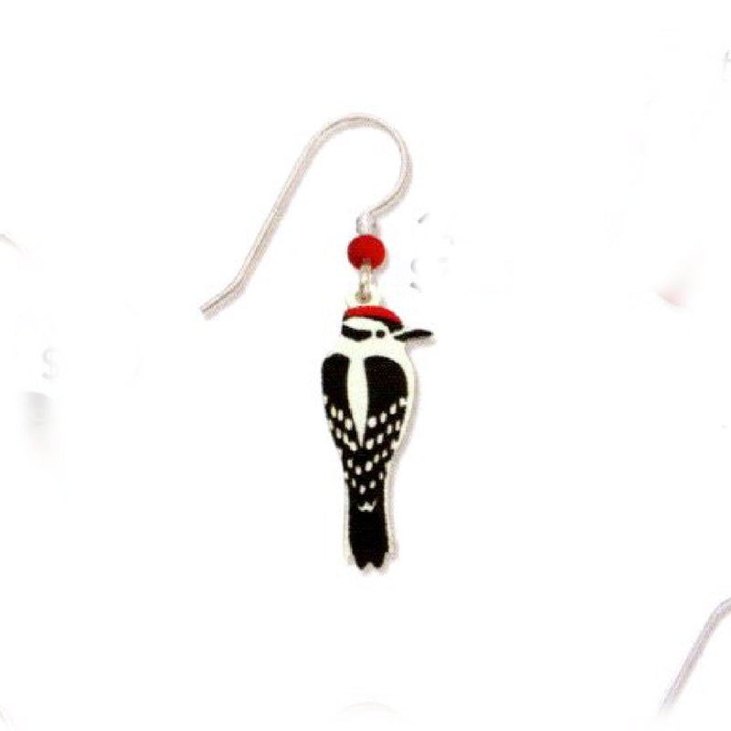 Downy Woodpecker earring with red accent on a white background