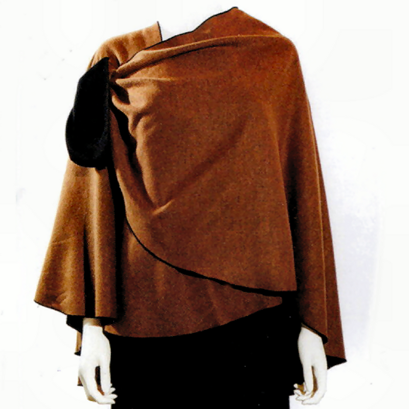 A draped Kobicha (brown) shawl with a black reversible side. using a Buckle for closure, is on a white mannequin against a plain white background.