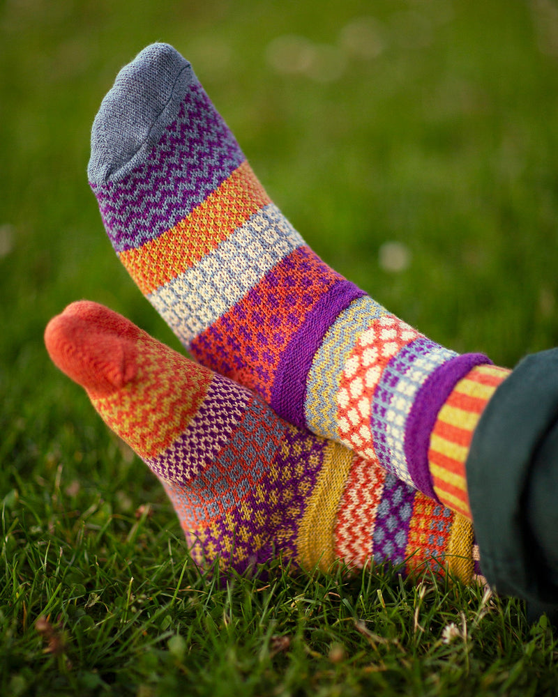 Solmate Hazel Sock worn by a Model on a field of Green Grass.