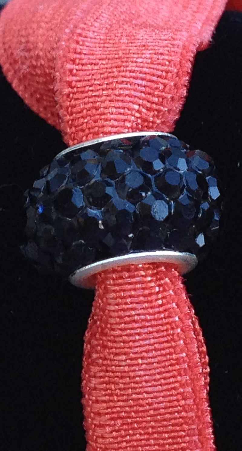 Coquelcot Orange Hair Tie with Black Bead
